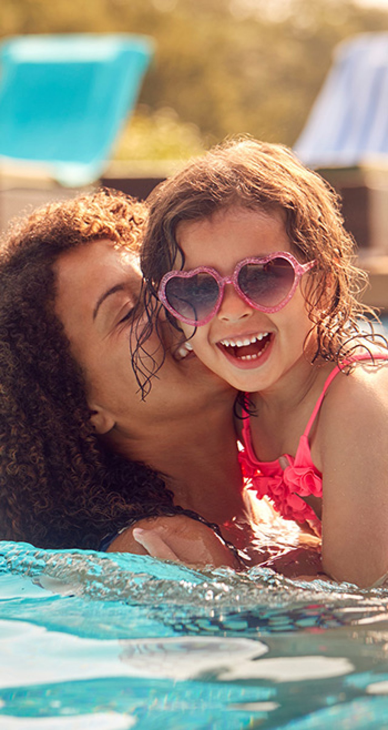 Mother and daughter in the pool